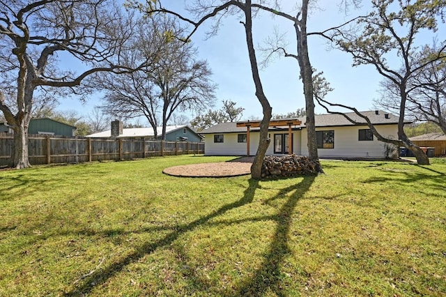 view of yard with a patio and fence