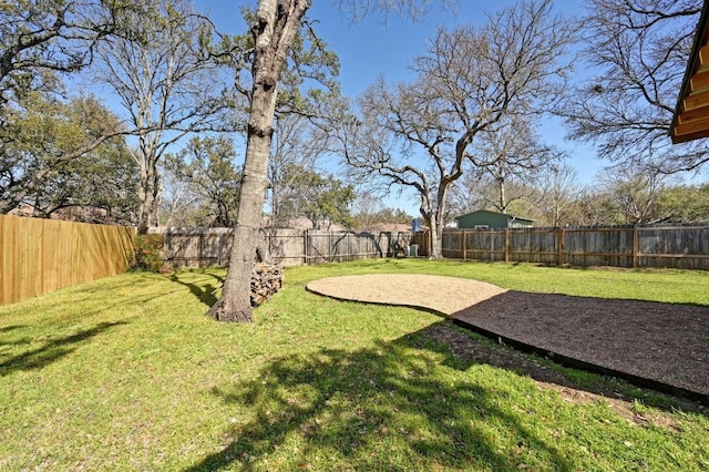 view of yard with a fenced backyard