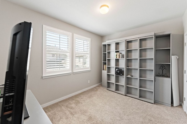 interior space featuring baseboards