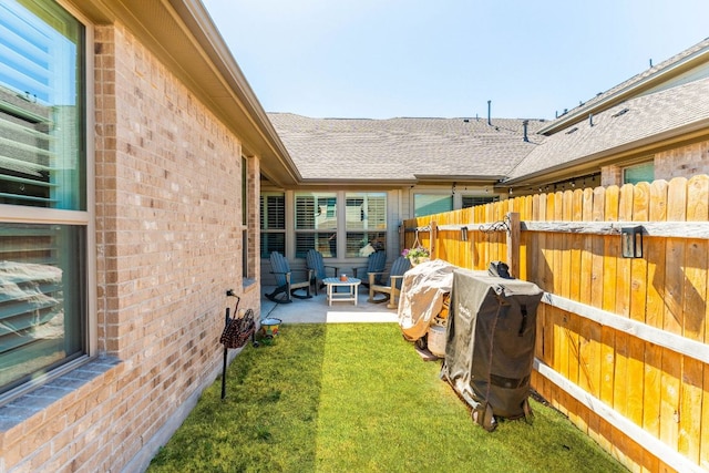 view of yard with a patio and fence