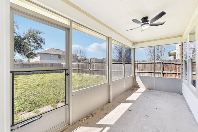 sunroom featuring ceiling fan