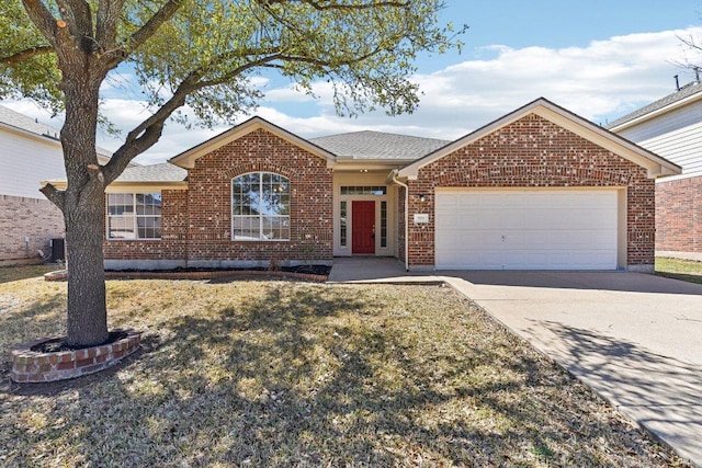 ranch-style home with a front yard, roof with shingles, concrete driveway, a garage, and brick siding