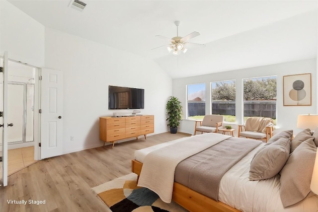 bedroom with vaulted ceiling, visible vents, light wood finished floors, and ceiling fan