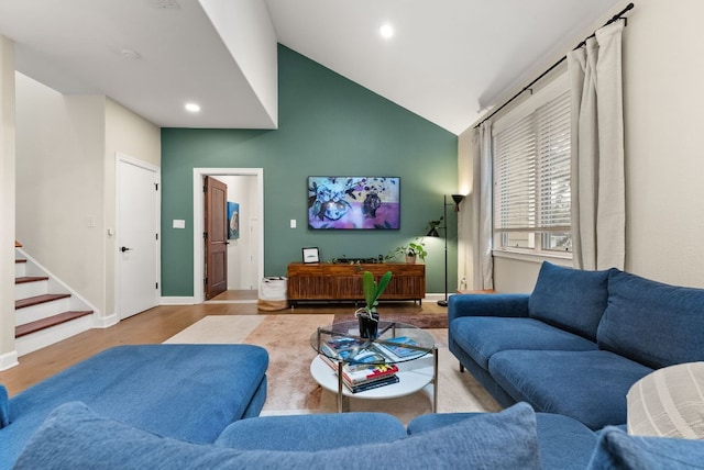 living room featuring recessed lighting, stairway, baseboards, and wood finished floors