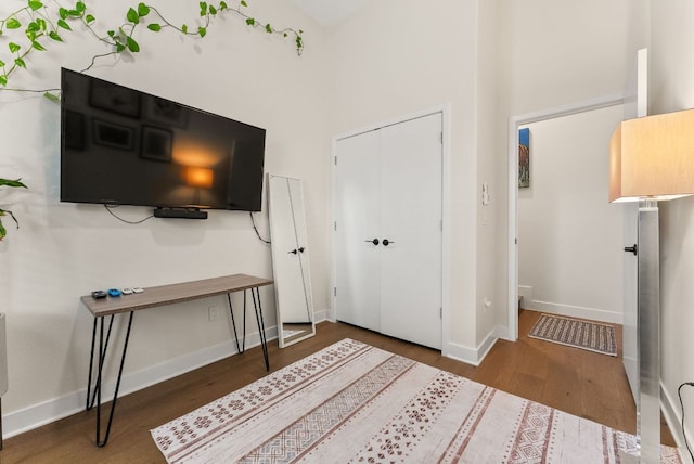 entrance foyer with baseboards and wood finished floors