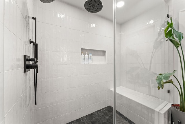 full bath featuring a tile shower