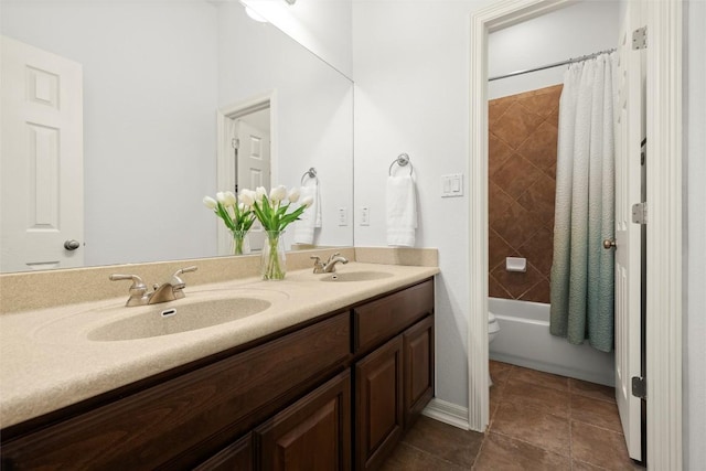 full bathroom with tile patterned flooring, double vanity, shower / bath combination with curtain, and a sink