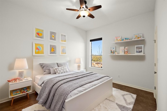 bedroom with a ceiling fan and baseboards