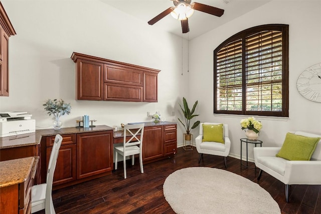 office area with baseboards, dark wood-style flooring, and ceiling fan