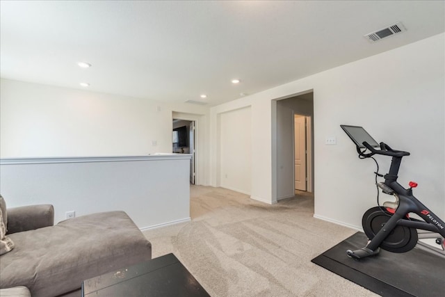 workout area featuring recessed lighting, visible vents, light colored carpet, and baseboards