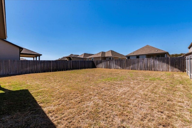 view of yard featuring a fenced backyard