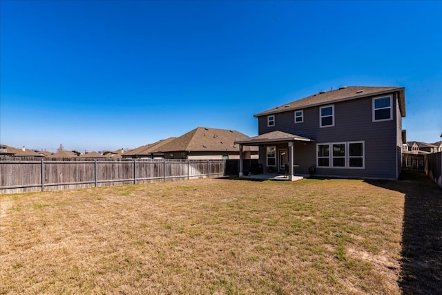 185 Six Shooter Dr, Kyle, TX 78640 - back of house featuring a patio area and a fenced backyard