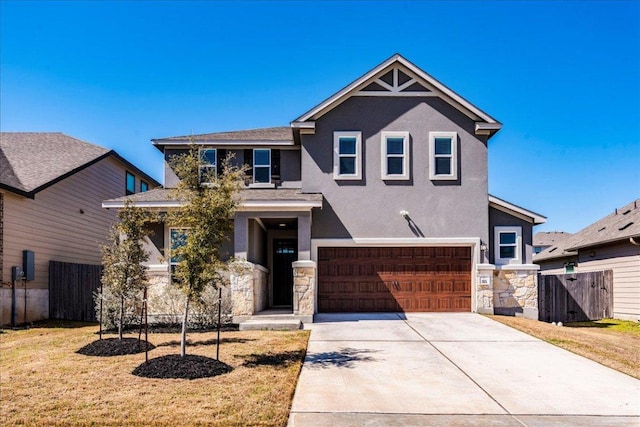 craftsman inspired home with a garage, stone siding, stucco siding, and fence