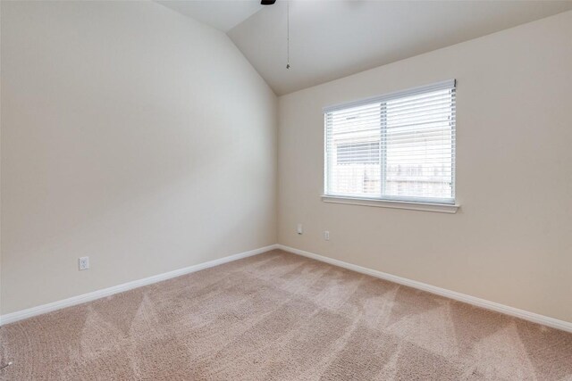 108 Trailstone Dr, Bastrop, TX 78602 - spare room featuring light carpet, ceiling fan, lofted ceiling, and baseboards