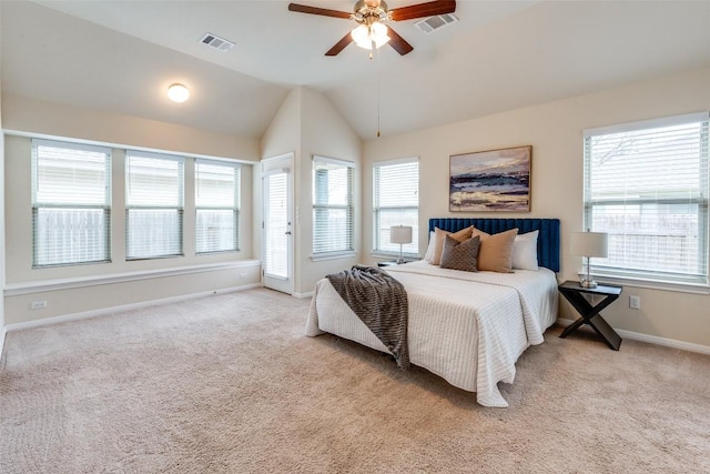 bedroom featuring visible vents, light colored carpet, and multiple windows