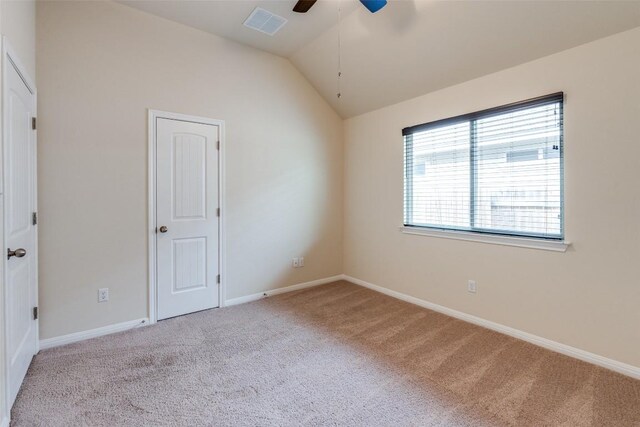 108 Trailstone Dr, Bastrop, TX 78602 - unfurnished bedroom with carpet floors, lofted ceiling, baseboards, and a ceiling fan