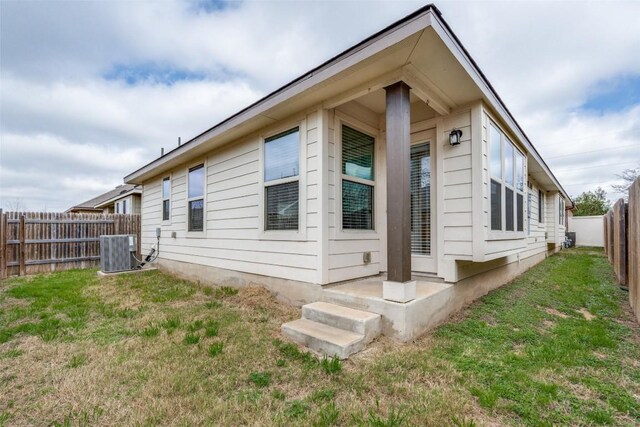 108 Trailstone Dr, Bastrop, TX 78602 - view of property exterior featuring central AC