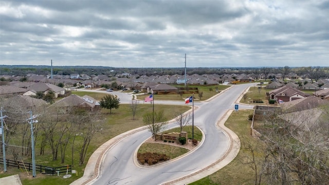 birds eye view of property with a residential view