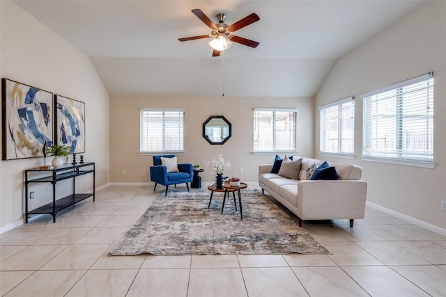 living area with lofted ceiling, light tile patterned floors, a healthy amount of sunlight, and ceiling fan