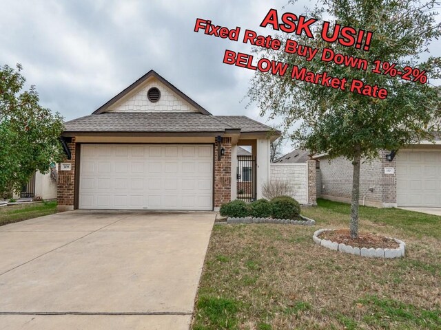 108 Trailstone Dr, Bastrop, TX 78602 - view of front of house featuring brick siding, driveway, a garage, and a shingled roof