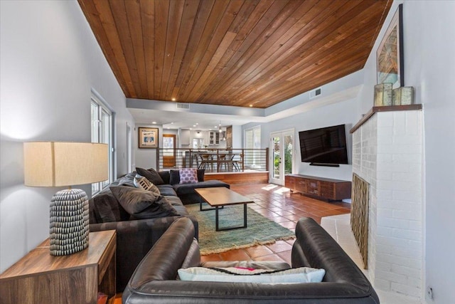 tiled living room featuring visible vents, recessed lighting, and wooden ceiling