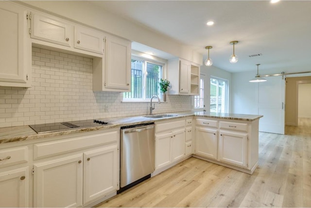 kitchen with a sink, stainless steel dishwasher, white cabinetry, a peninsula, and black electric stovetop