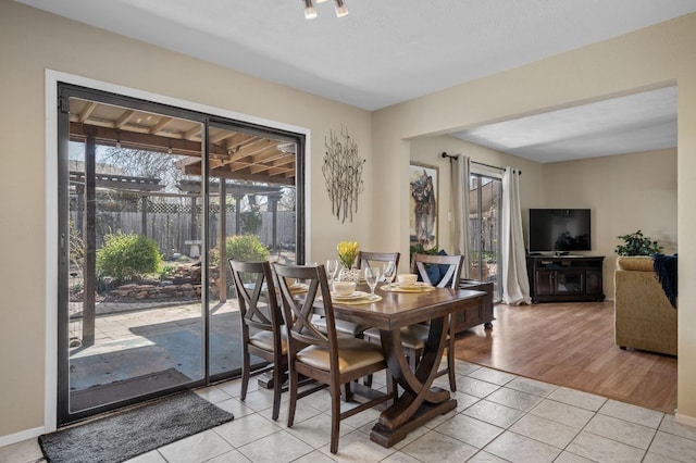 1807 Morning Quail Dr, Austin, TX 78758 - dining space with light tile patterned flooring and baseboards