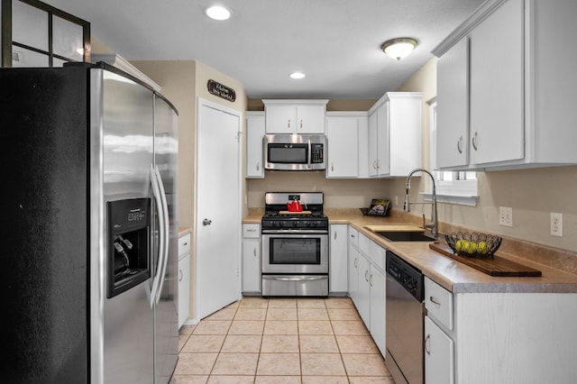 1807 Morning Quail Dr, Austin, TX 78758 - kitchen featuring stainless steel appliances, a sink, light countertops, white cabinets, and recessed lighting