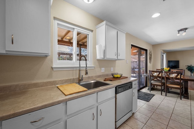 1807 Morning Quail Dr, Austin, TX 78758 - kitchen with dishwasher, healthy amount of natural light, white cabinetry, and a sink
