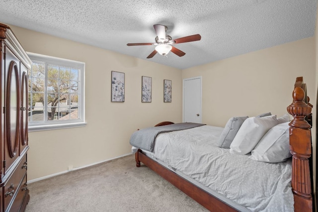 1807 Morning Quail Dr, Austin, TX 78758 - bedroom with light colored carpet, a textured ceiling, a ceiling fan, and baseboards