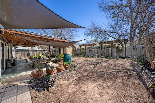 1807 Morning Quail Dr, Austin, TX 78758 - fenced backyard featuring a patio, a pergola, and a ceiling fan
