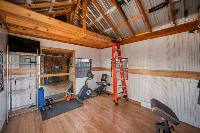 1807 Morning Quail Dr, Austin, TX 78758 - exercise room featuring vaulted ceiling, wood finished floors, and a workshop area