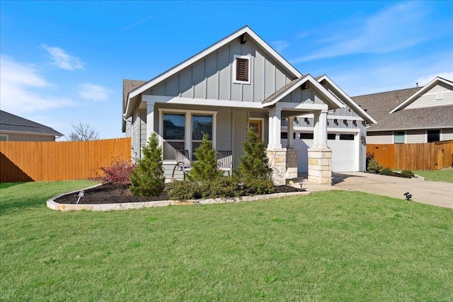 craftsman inspired home featuring driveway, a front lawn, fence, board and batten siding, and a garage