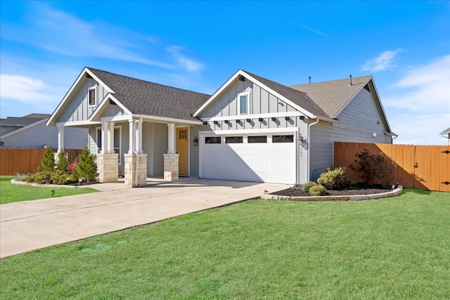 craftsman-style house featuring fence, board and batten siding, driveway, and roof with shingles