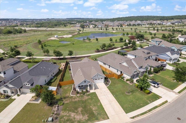 aerial view with a residential view and a water view