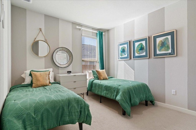 bedroom featuring baseboards and carpet floors