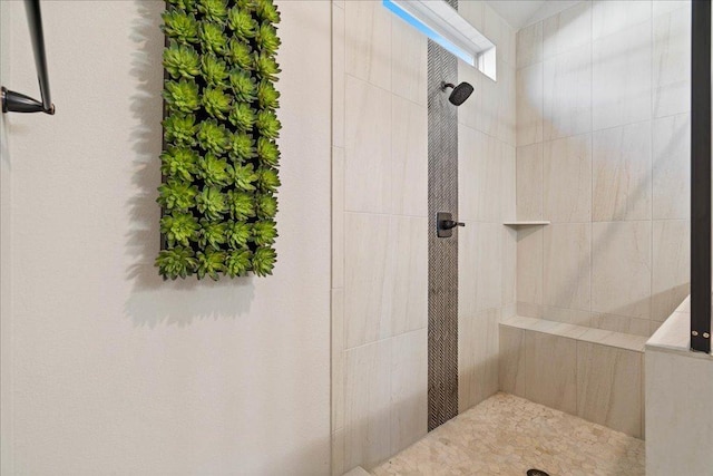 bathroom featuring tiled shower