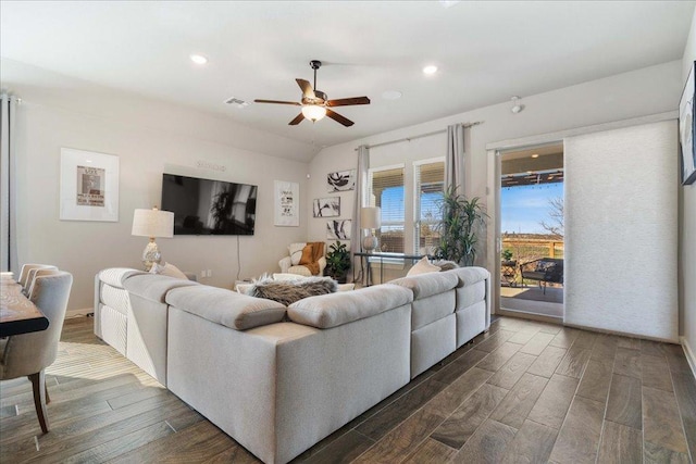 living area featuring recessed lighting, visible vents, dark wood-type flooring, and a ceiling fan