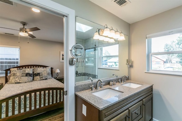 bathroom with a sink, visible vents, and a wealth of natural light