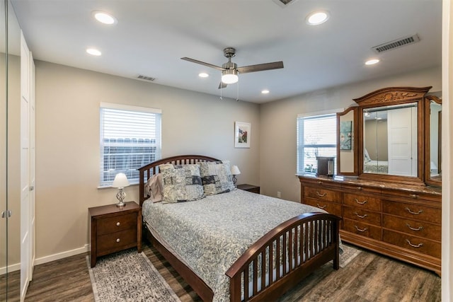 bedroom featuring recessed lighting, visible vents, baseboards, and dark wood-style floors