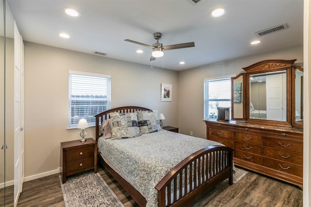 6519 Pevensey Dr, Austin, TX 78745 - bedroom with dark wood-style flooring, multiple windows, recessed lighting, and a ceiling fan