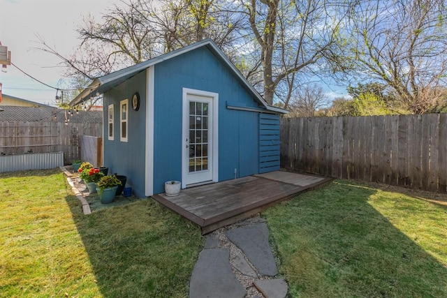 view of outdoor structure with an outdoor structure and a fenced backyard