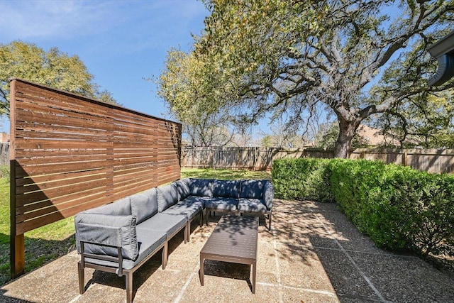 view of patio with an outdoor hangout area and a fenced backyard