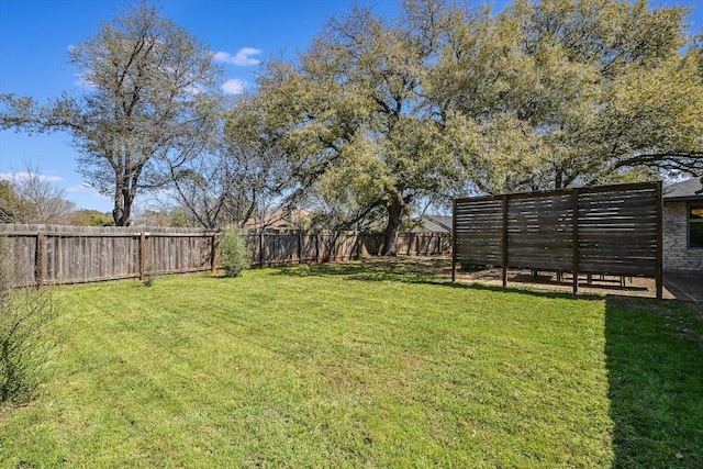 view of yard featuring a fenced backyard