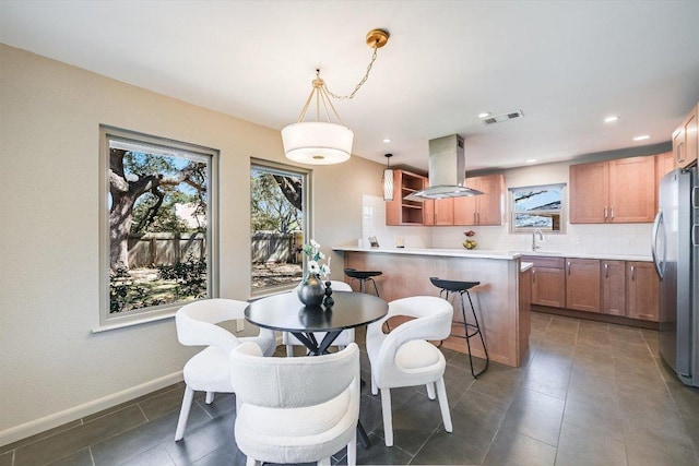 dining space with tile patterned floors, recessed lighting, baseboards, and visible vents