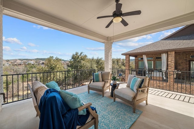 view of patio with an outdoor living space, a balcony, and ceiling fan