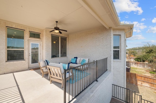 view of patio featuring outdoor lounge area, fence, and ceiling fan