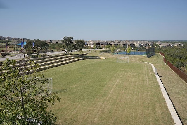 birds eye view of property with a residential view