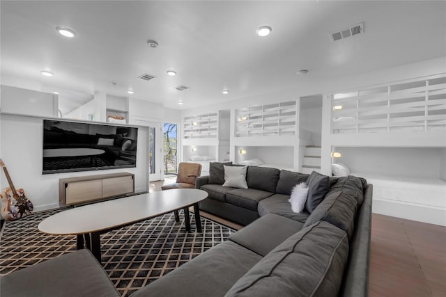 living room featuring recessed lighting, visible vents, and built in shelves