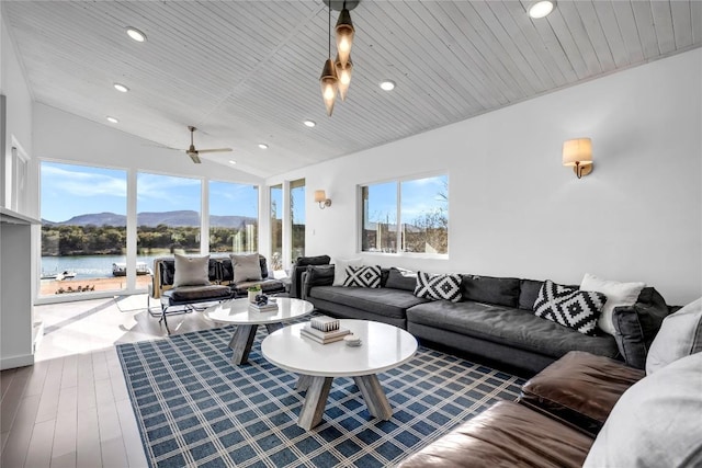 living area featuring lofted ceiling, wood ceiling, recessed lighting, and wood finished floors